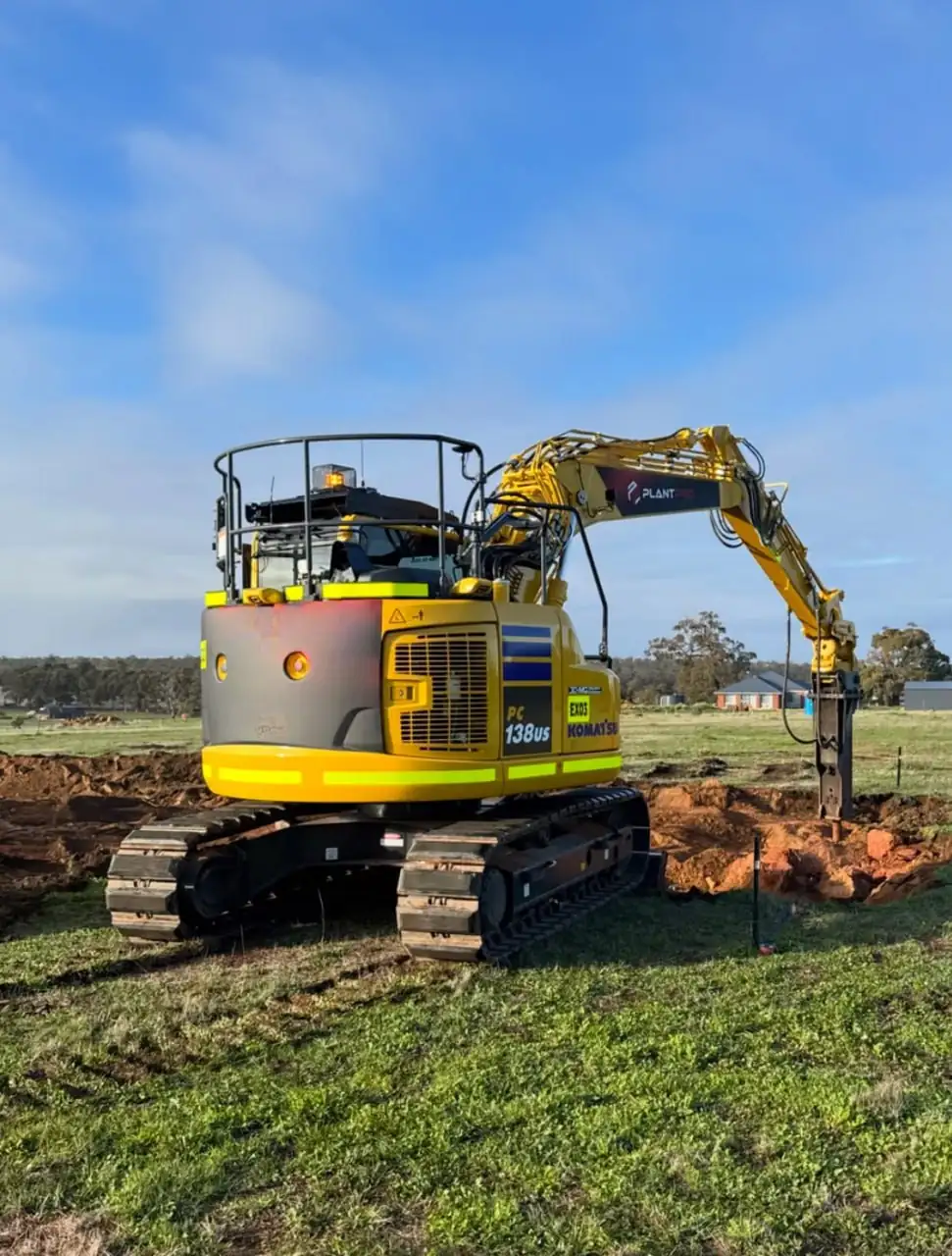 Komatsu PC138US-11 excavator working a bulk cut on a Perth earthworks site