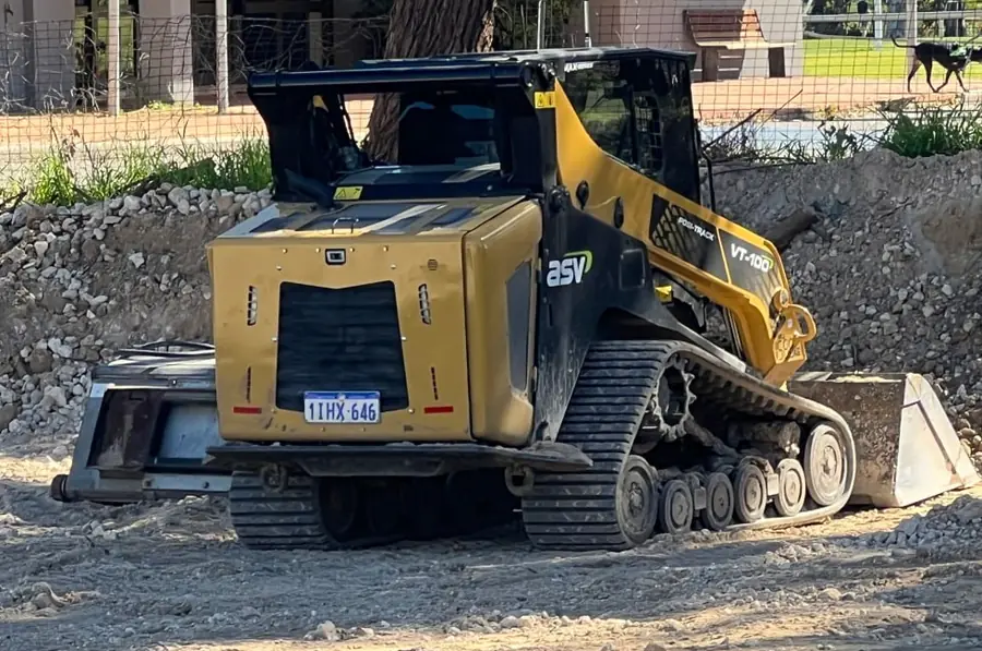 Tracked skid steer loader working in an excavation on a Perth site